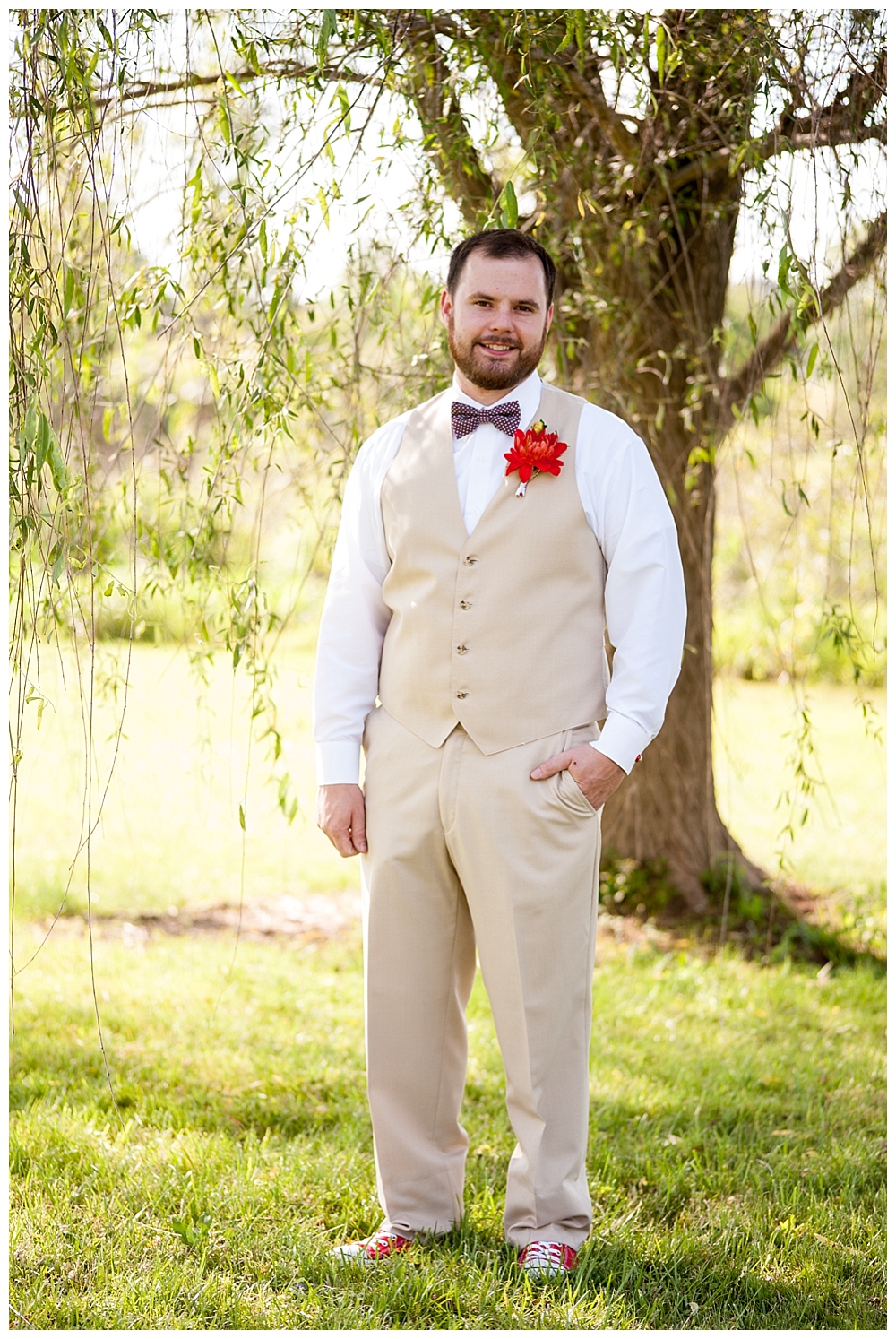 groom with red white and blue bow tie