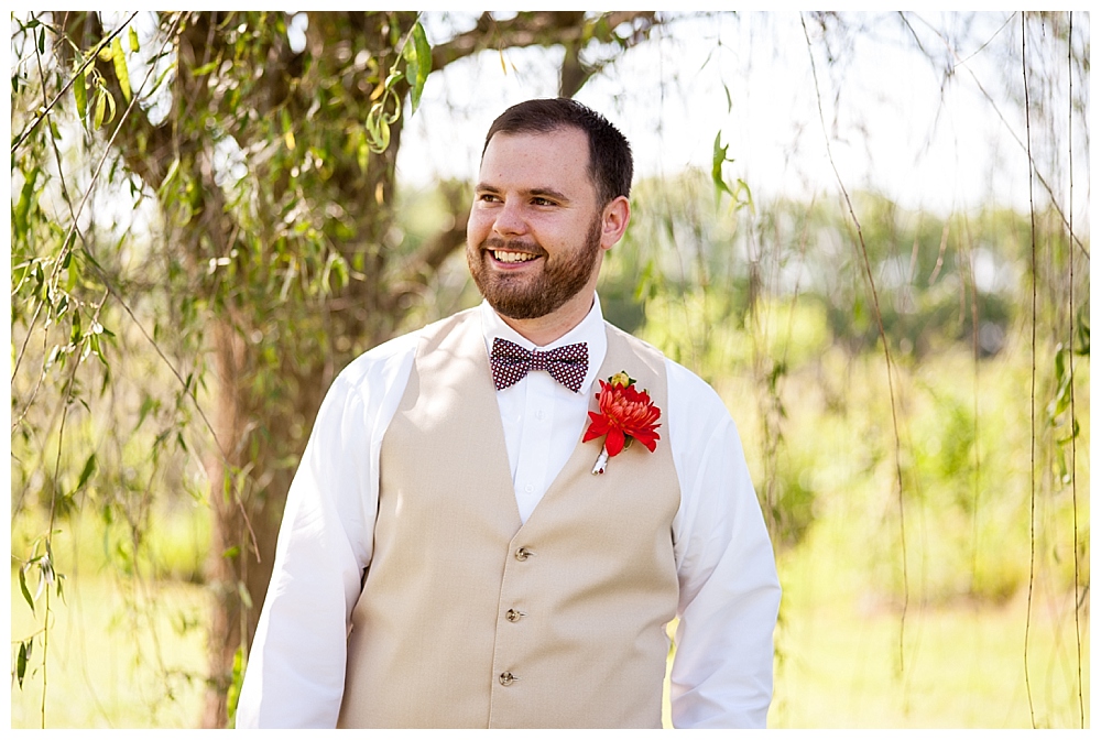 groom with red white and blue bow tie