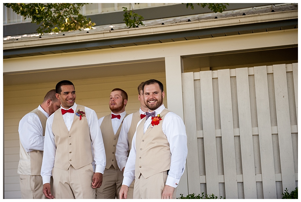 groom with red white and blue bow tie