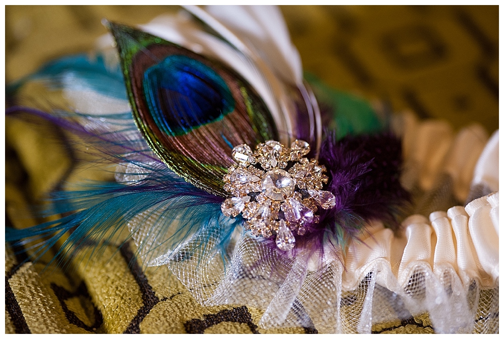 wedding garter with peacock feathers