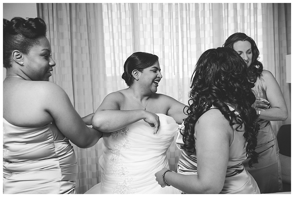 bride getting into dress