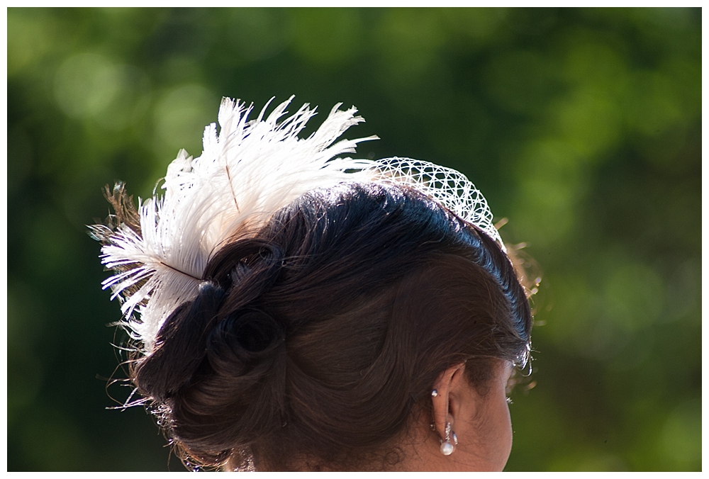 bride with feathers in hair