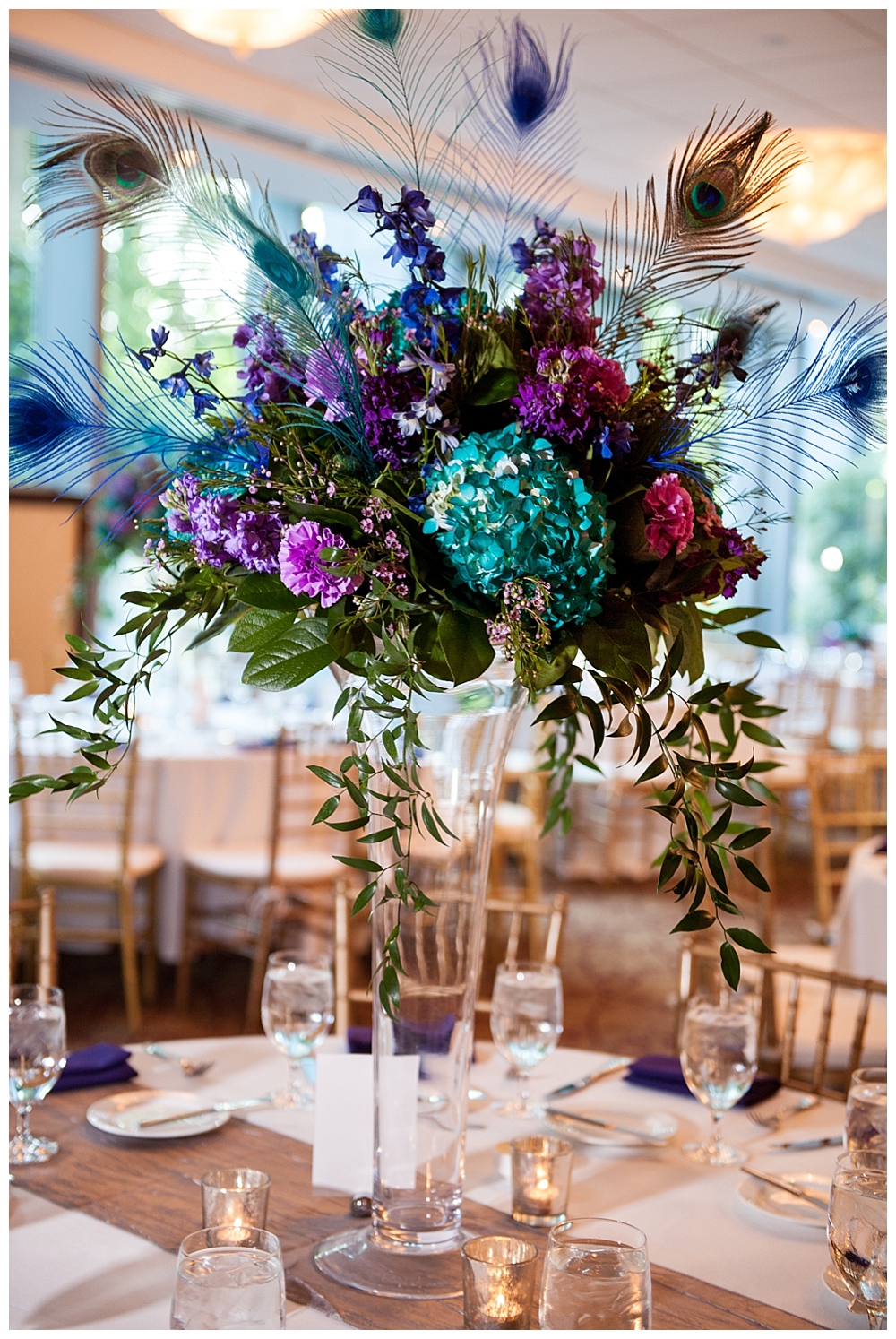 wedding reception tables with blue and purple centerpieces