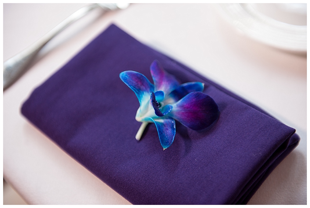 wedding reception purple napkin orchids