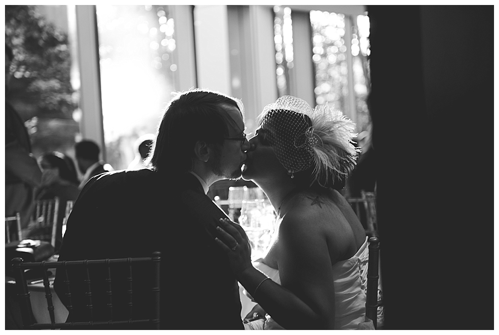 bride groom reception kiss silhouette