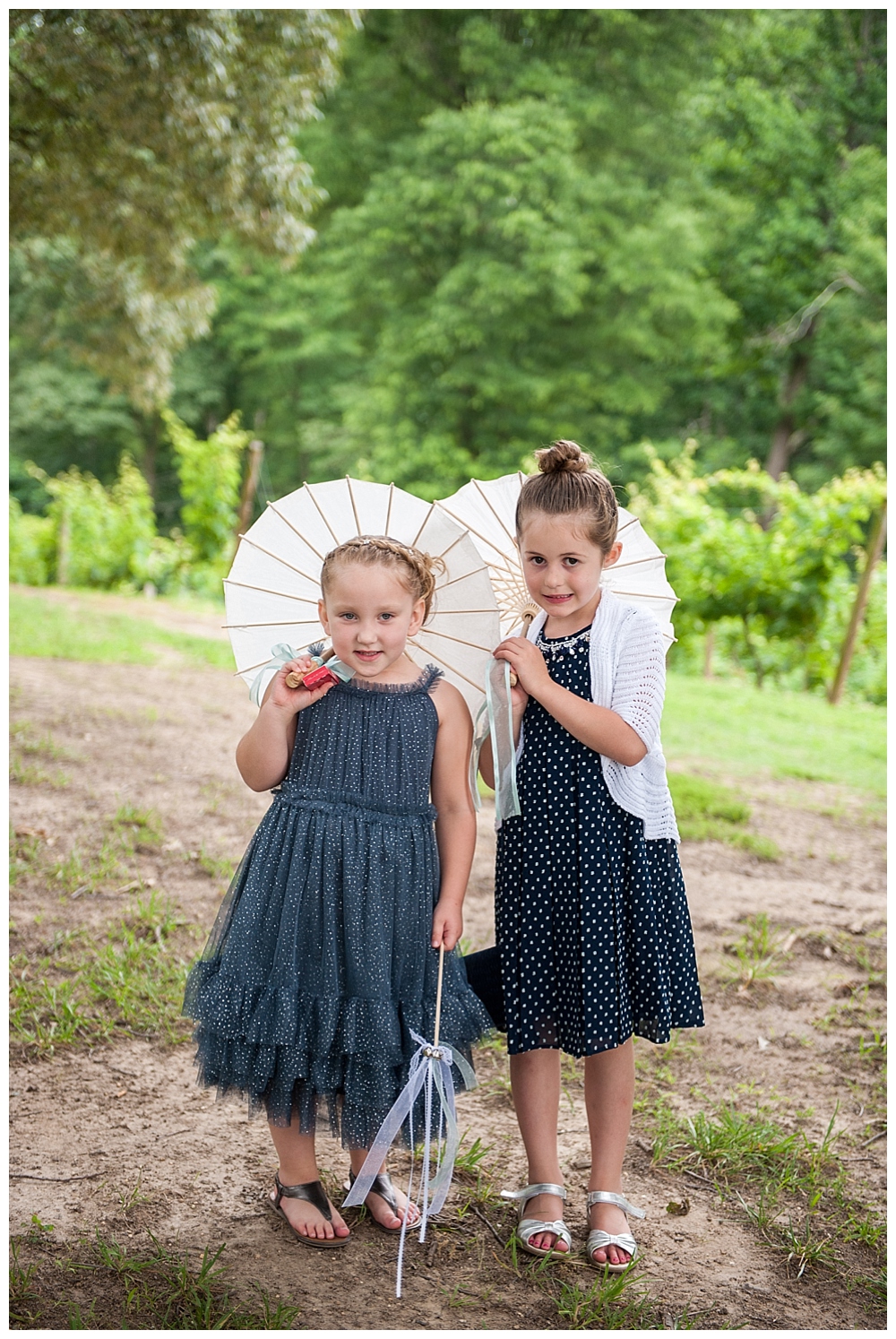 little girls with parasols