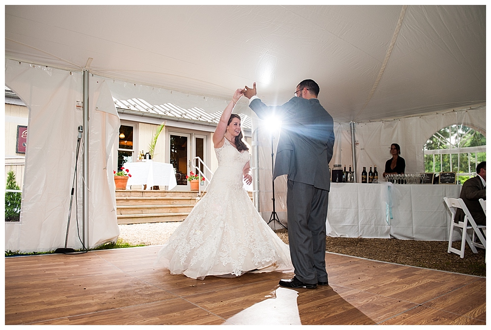 bride and groom first dance with backlight