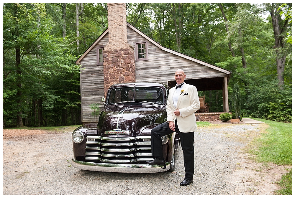 groom in tux with old truck