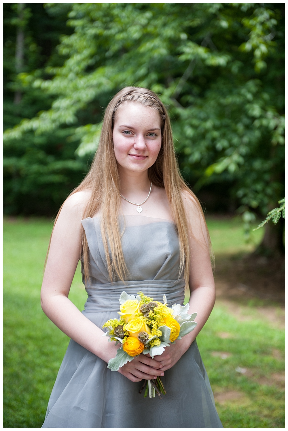 bridesmaid in grey dress & yellow bouquet