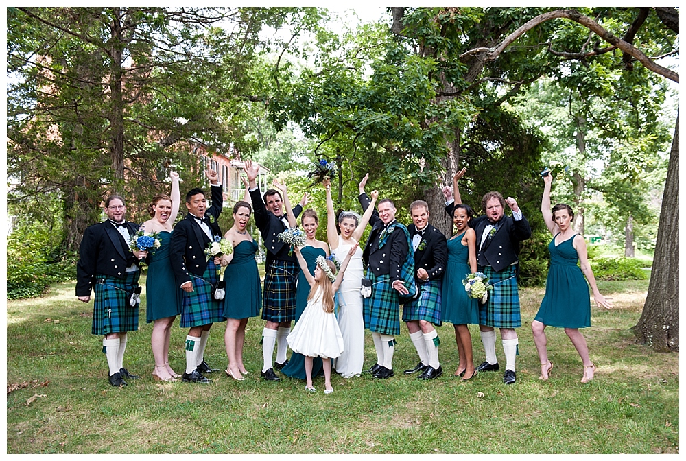 bridal party in kilts and green dresses