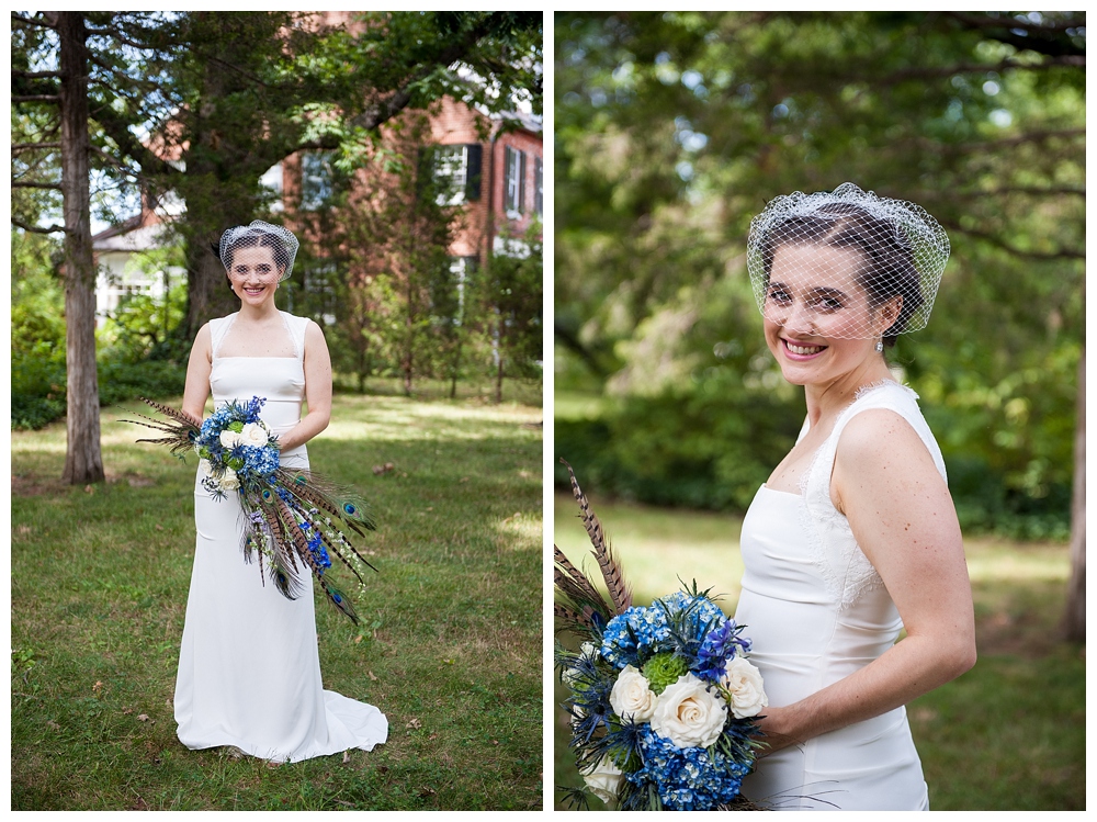 bridal portrait with bride in bird cage veil and blue bouquet with feathers