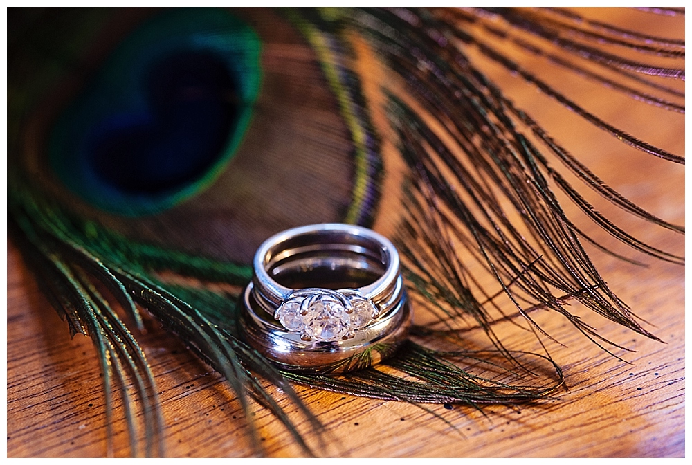 Wedding rings with peacock feather