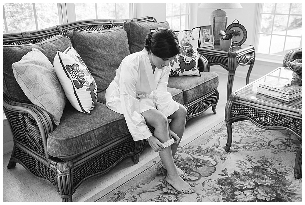 bride putting on garter