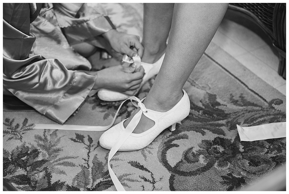 bride putting on shoes