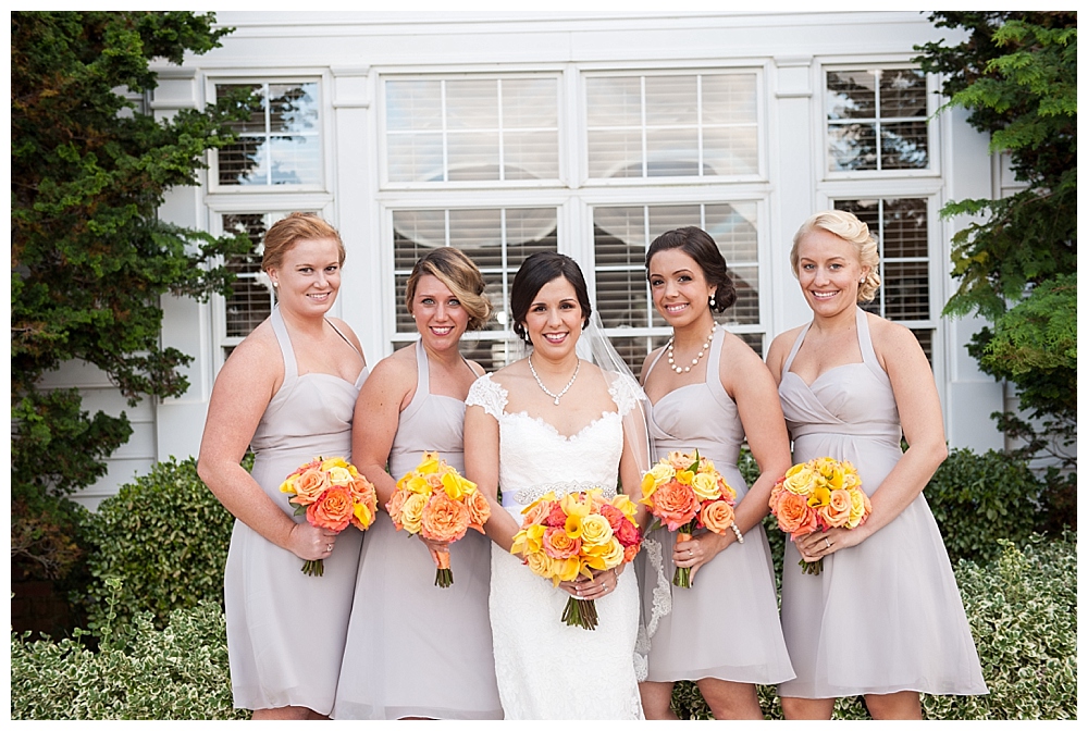 bridal party grey dresses yellow orange flowers