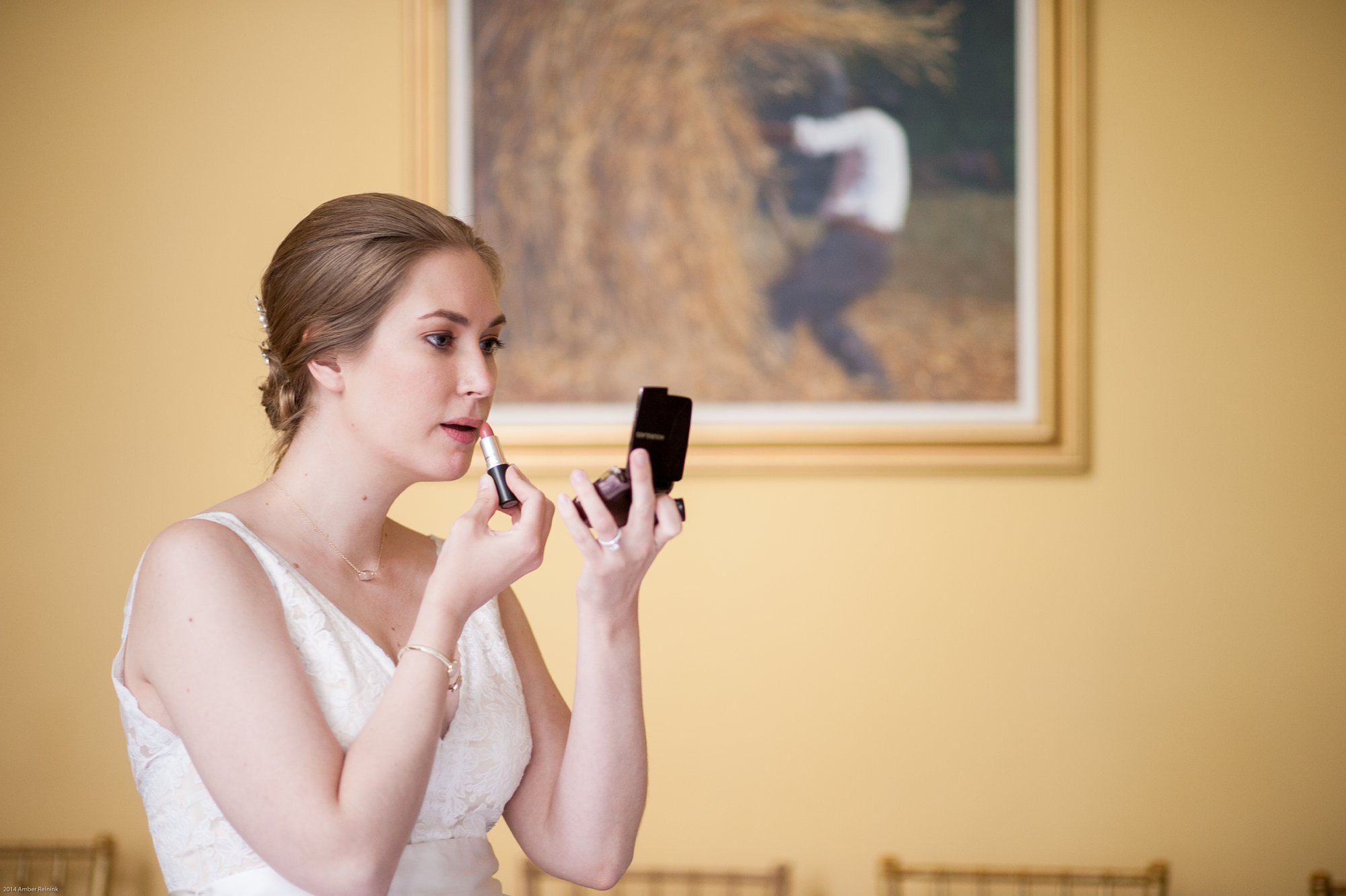 bride applying makeup during 2941 restaurant wedding Vienna Virginia