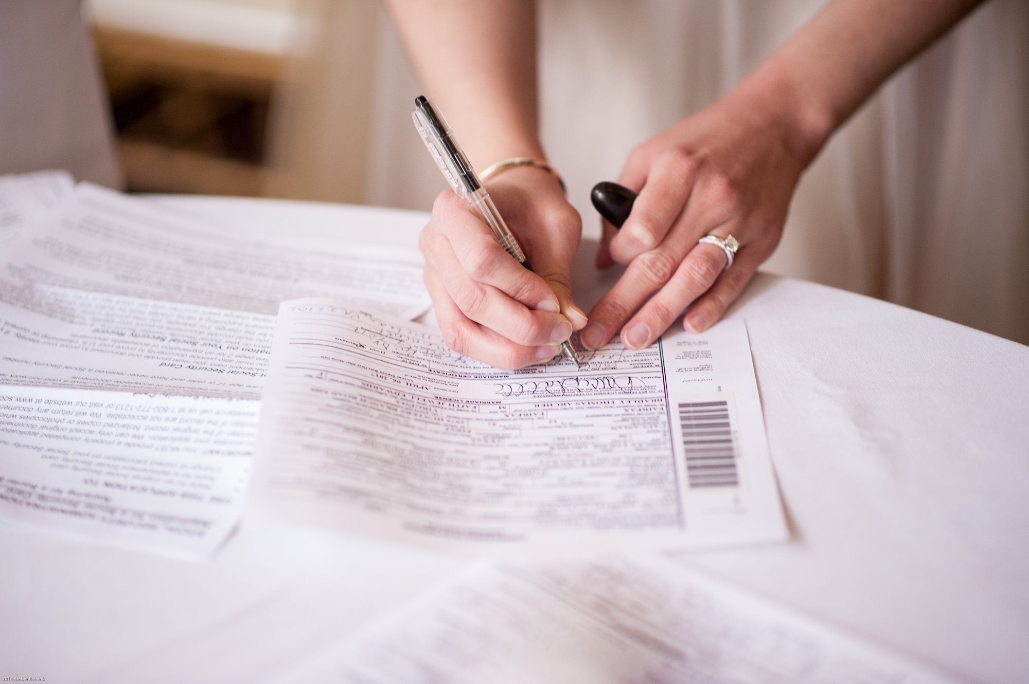 bride signing marriage license during 2941 restaurant wedding Vienna Virginia