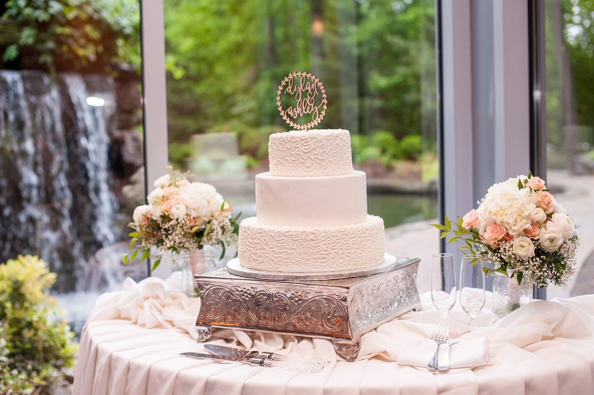 wedding cake with waterfall in background at 2941 restaurant wedding Vienna Virginia