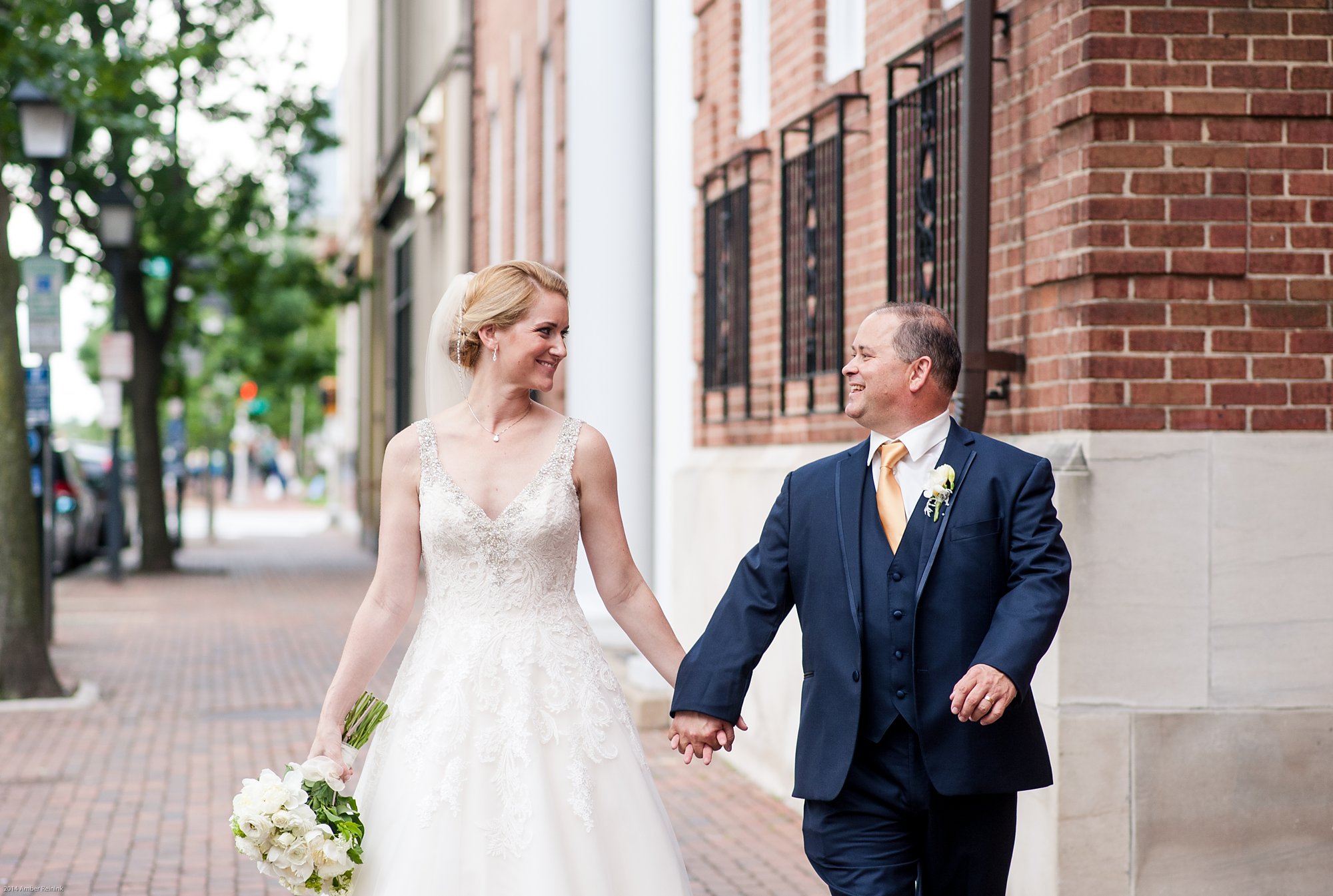 the alexandrian hotel wedding pictures Alexandria Virginia bride and groom portrait walking down sidewalk