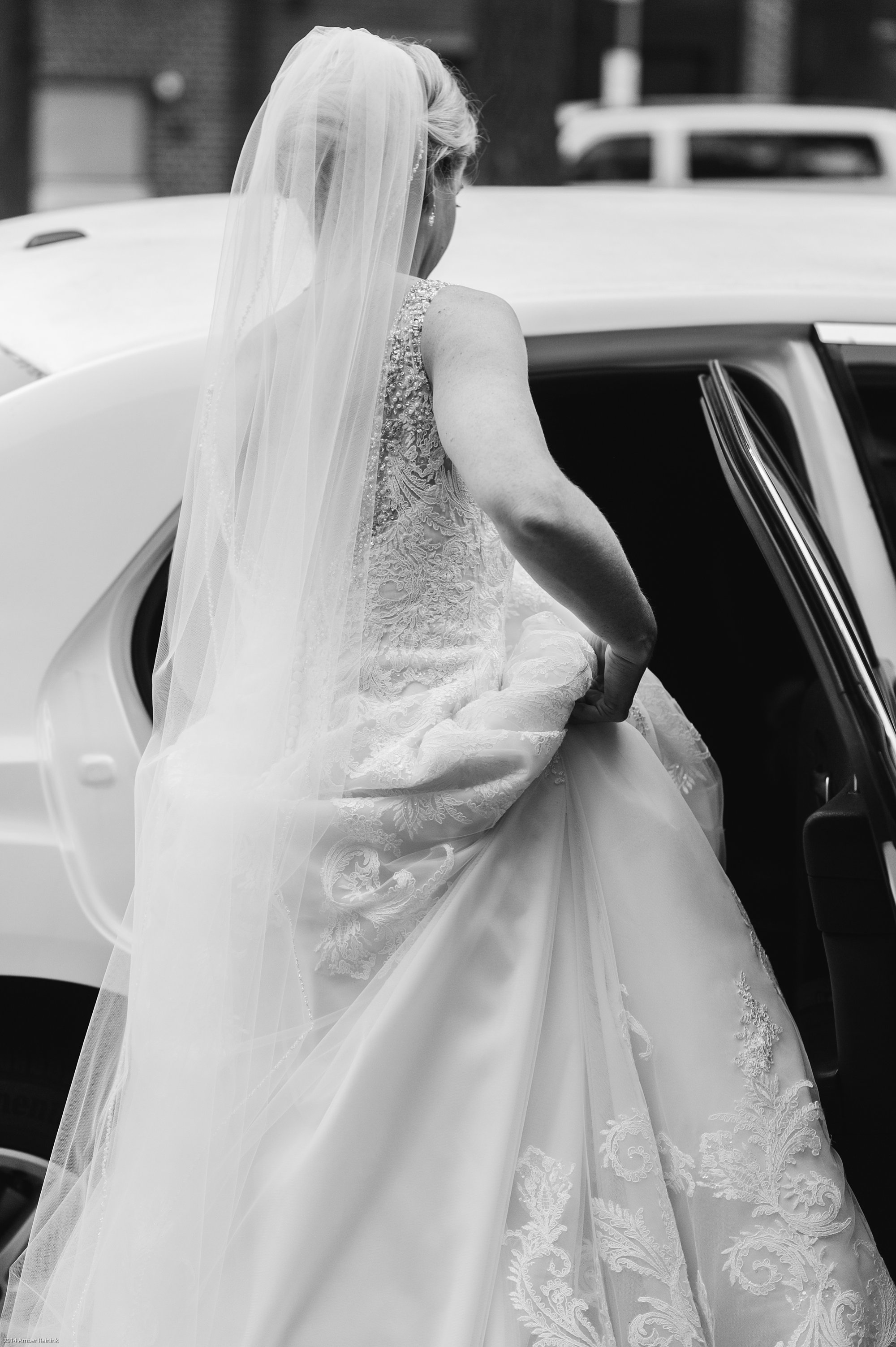 the alexandrian hotel wedding pictures Alexandria Virginia bride getting into limo