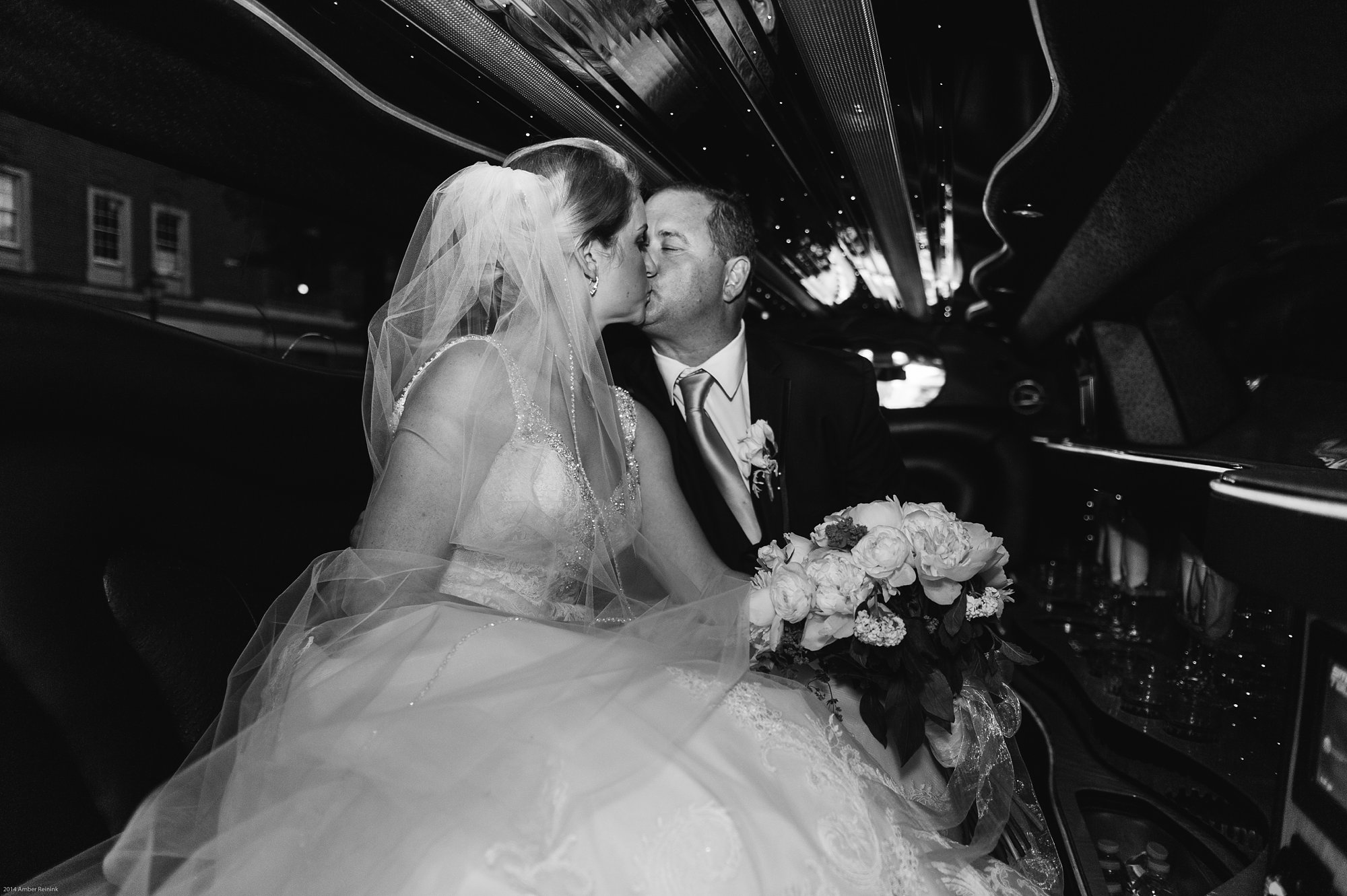 the alexandrian hotel wedding pictures Alexandria Virginia bride and groom in limo kissing