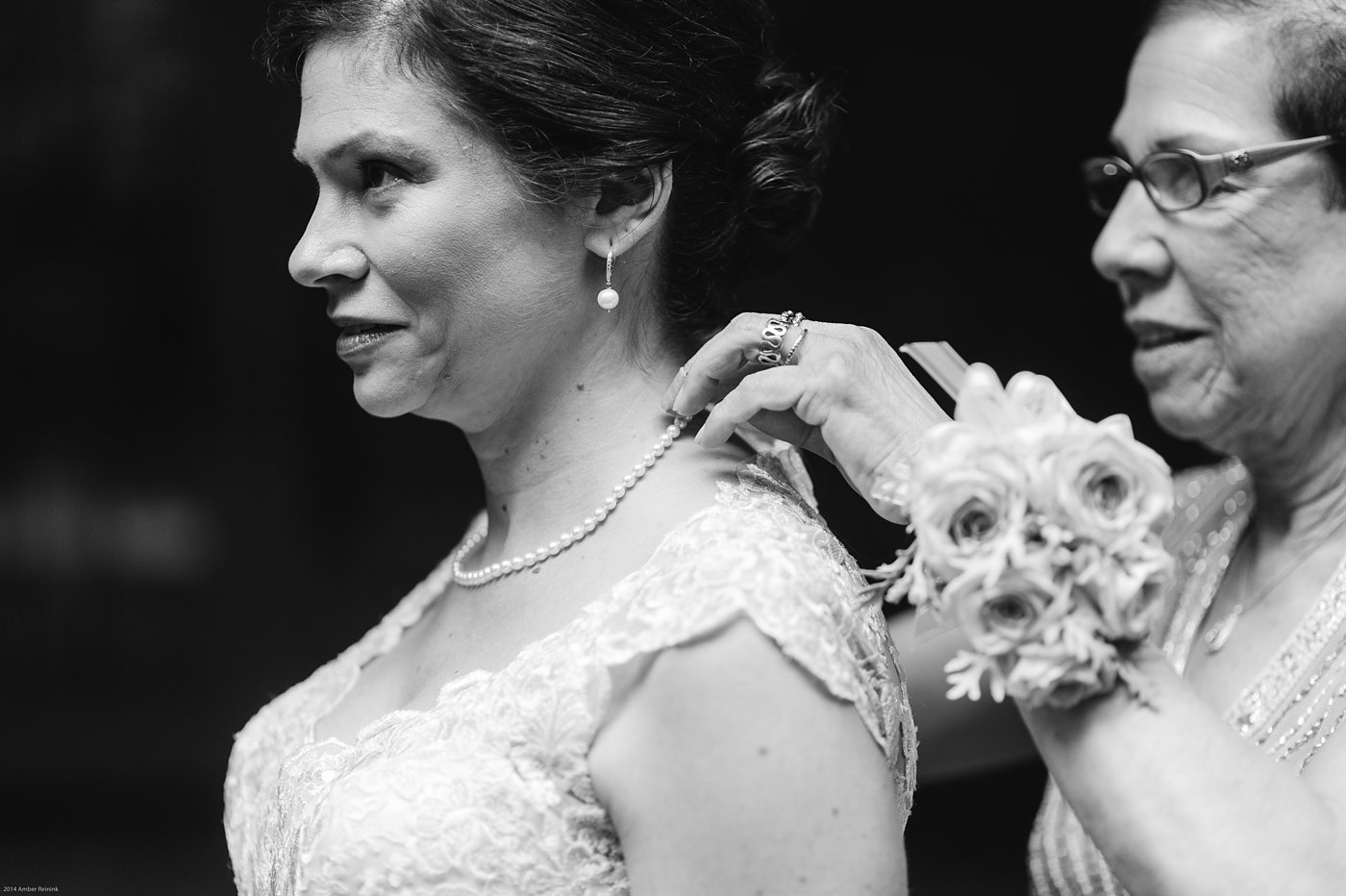 Bride getting ready with mother putting on her pearls at Thorpewood Mountain Memories Wedding Thurmont, MD