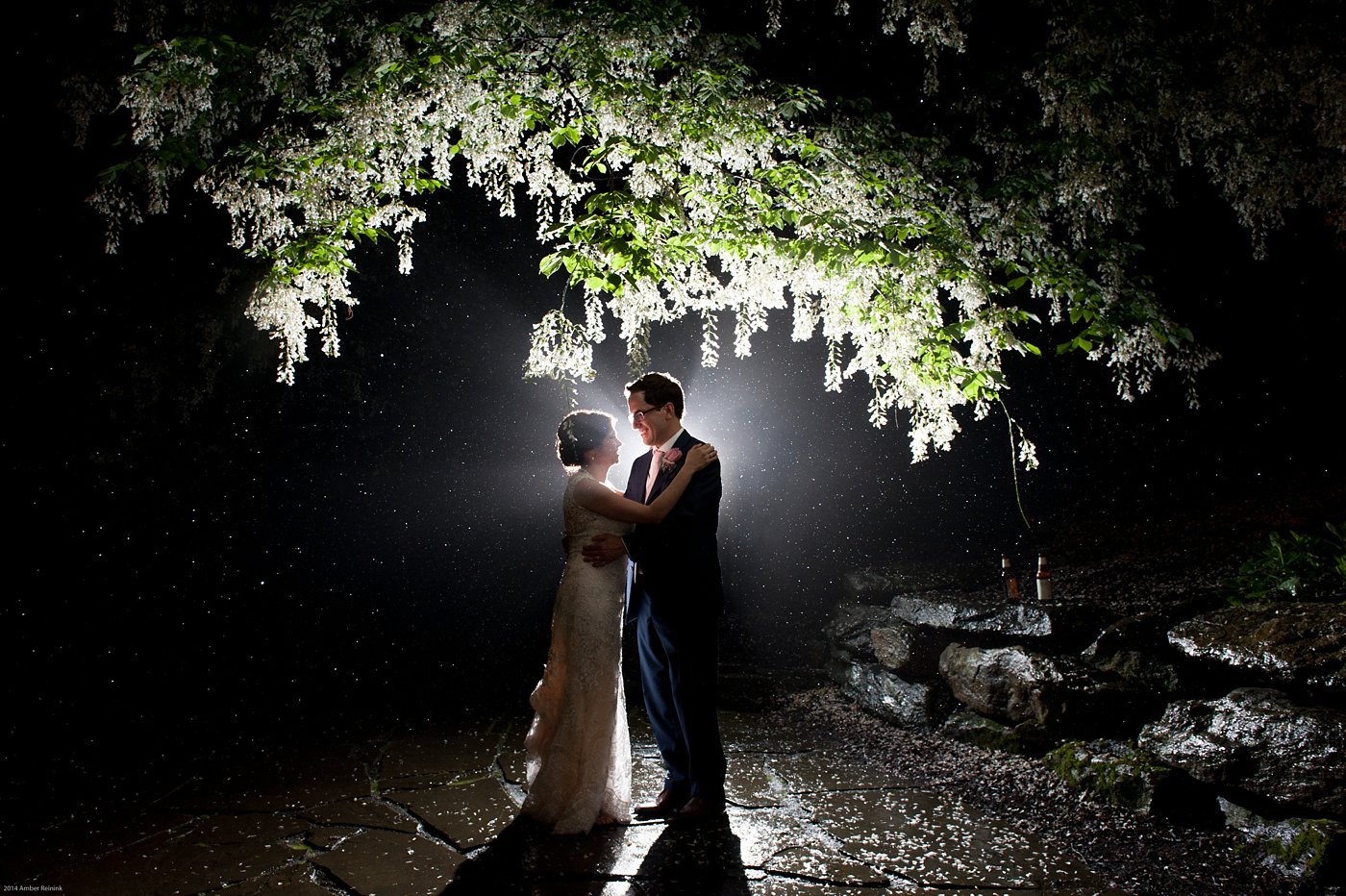 Bride and groom night time silhouette picture under white flowering tree in the rain Thorpewood Mountain Memories wedding Thurmont, MD